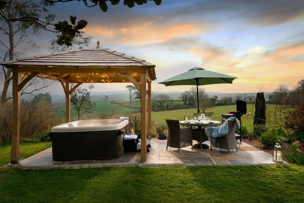 Image 1 of Linhay at East Trenean Farm -Luxury retreat for 2 with stunning rural views, private hot tub and EV charging