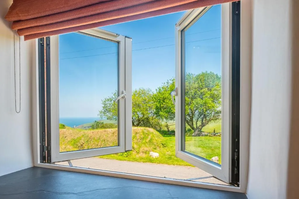 Image of Polrunny Farm Seaberry Cottage with a sea view and log burner