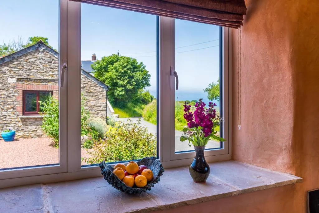 Image of Polrunny Farm sea view Blueberry Cottage with log burner